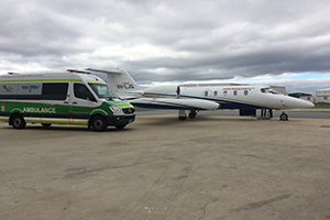 NETS ambulance and plane on the runway