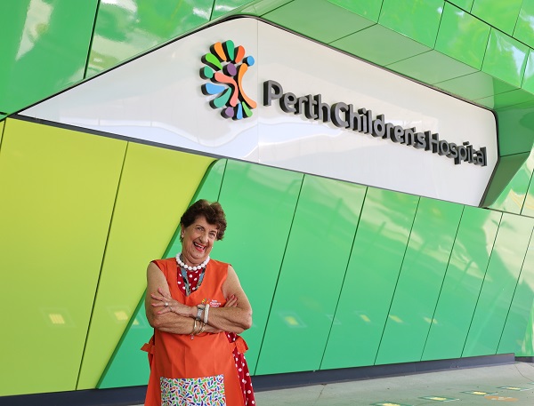 Dolores Peverall pictured smiling in front of Perth Children's Hospital