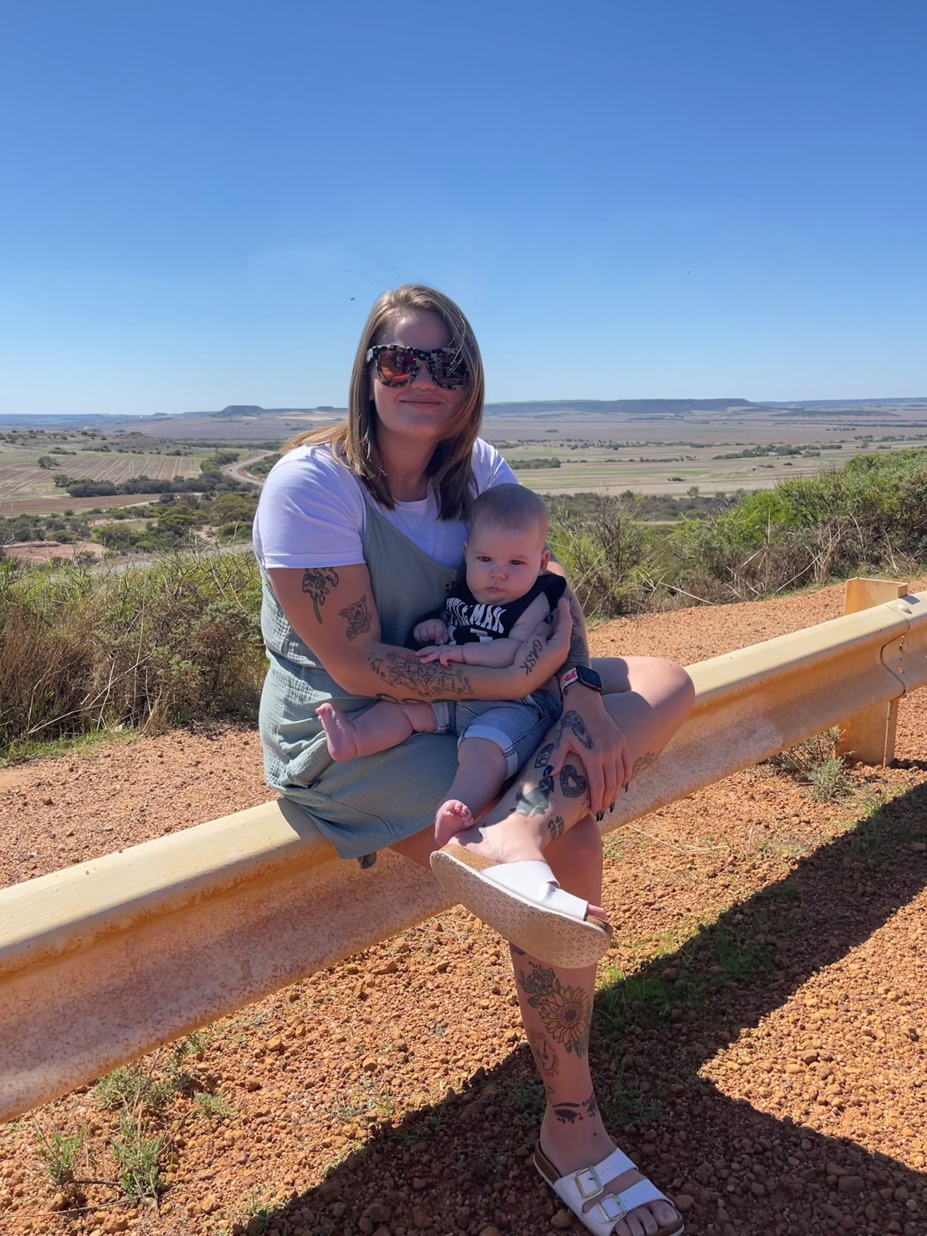 Mother holding baby with SMA diagnosis in regional Australian location