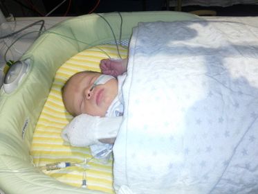 Baby Samantha in a crib in hospital