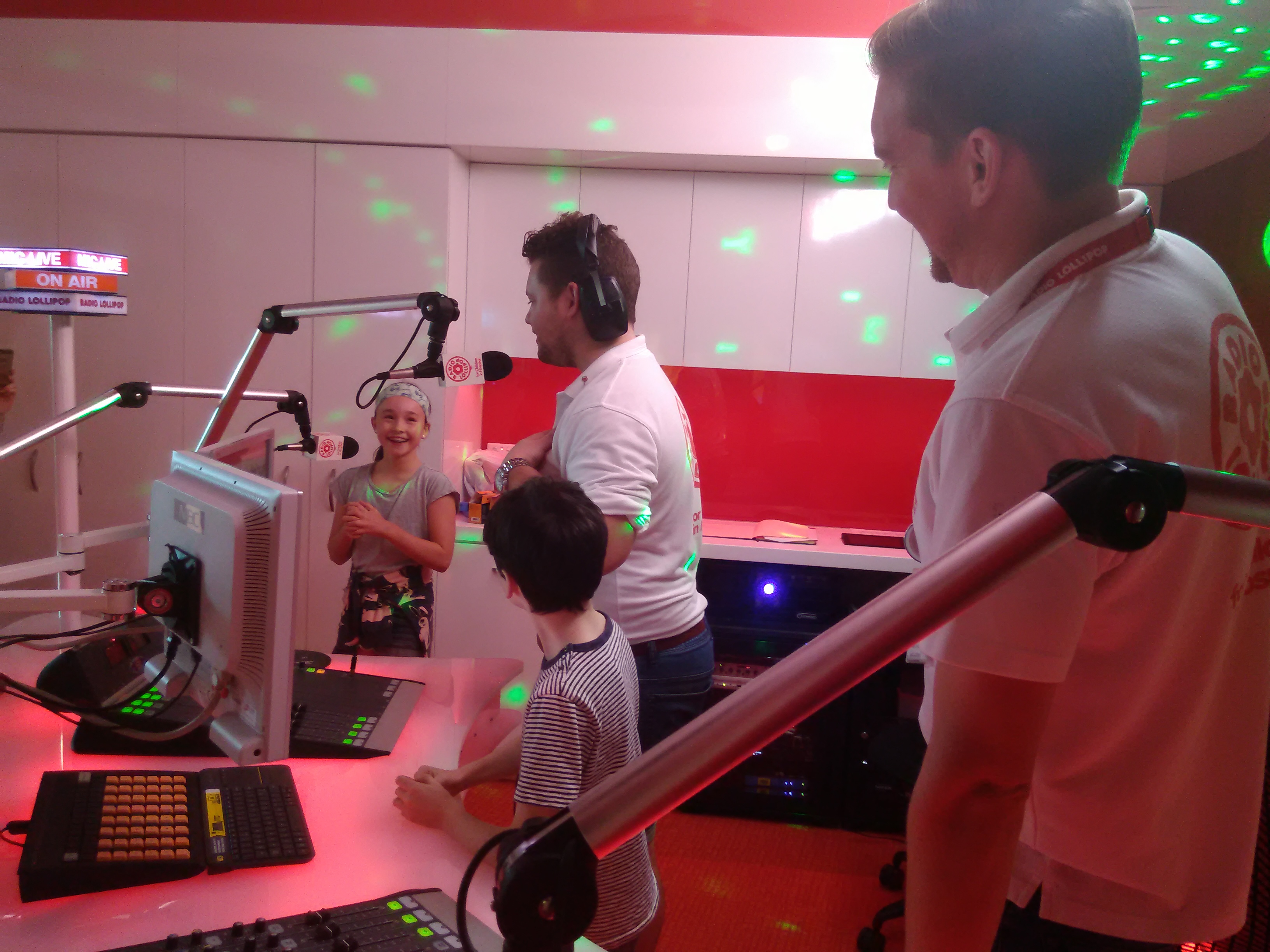 Children and presenters broadcasting from Radio Lollipop's studio at PCH